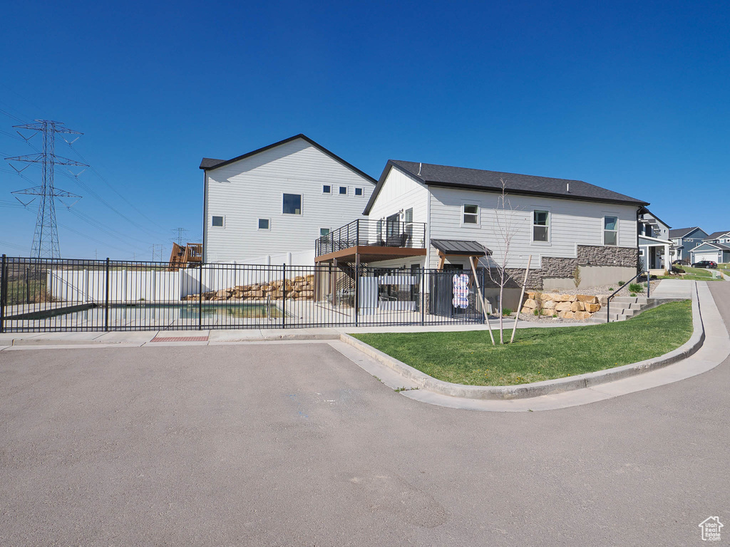 Rear view of house with fence