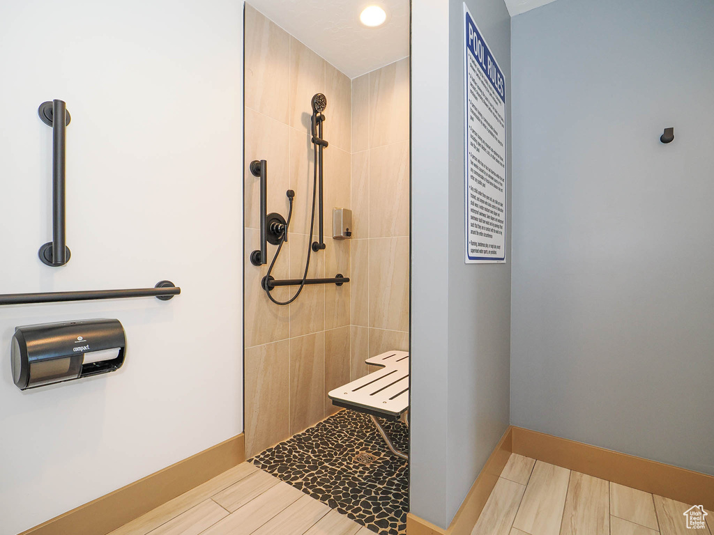 Bathroom with a walk in shower and baseboards