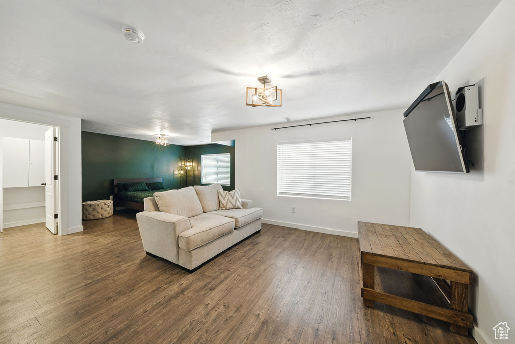 Living area with wood finished floors and baseboards