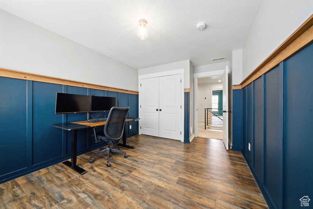 Office space featuring dark wood-style flooring