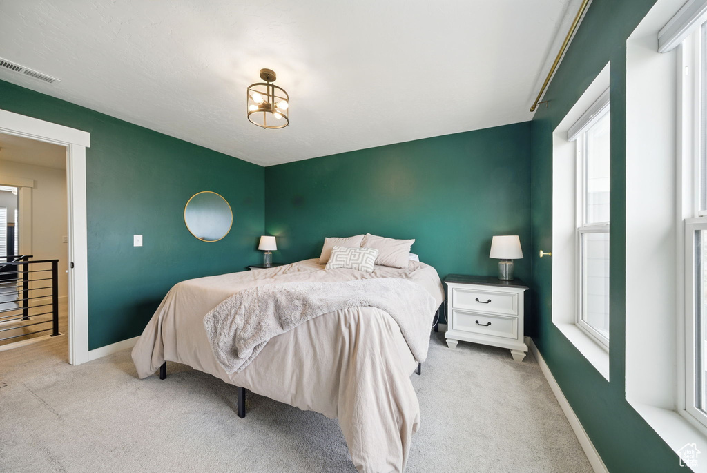 Carpeted bedroom with baseboards