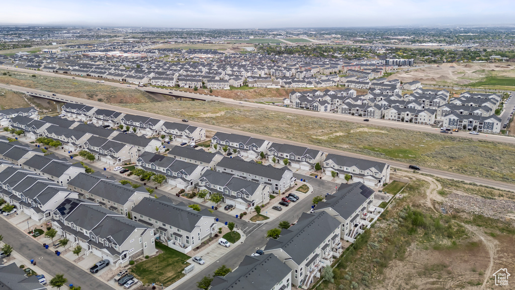 Aerial view of property's location with nearby suburban area
