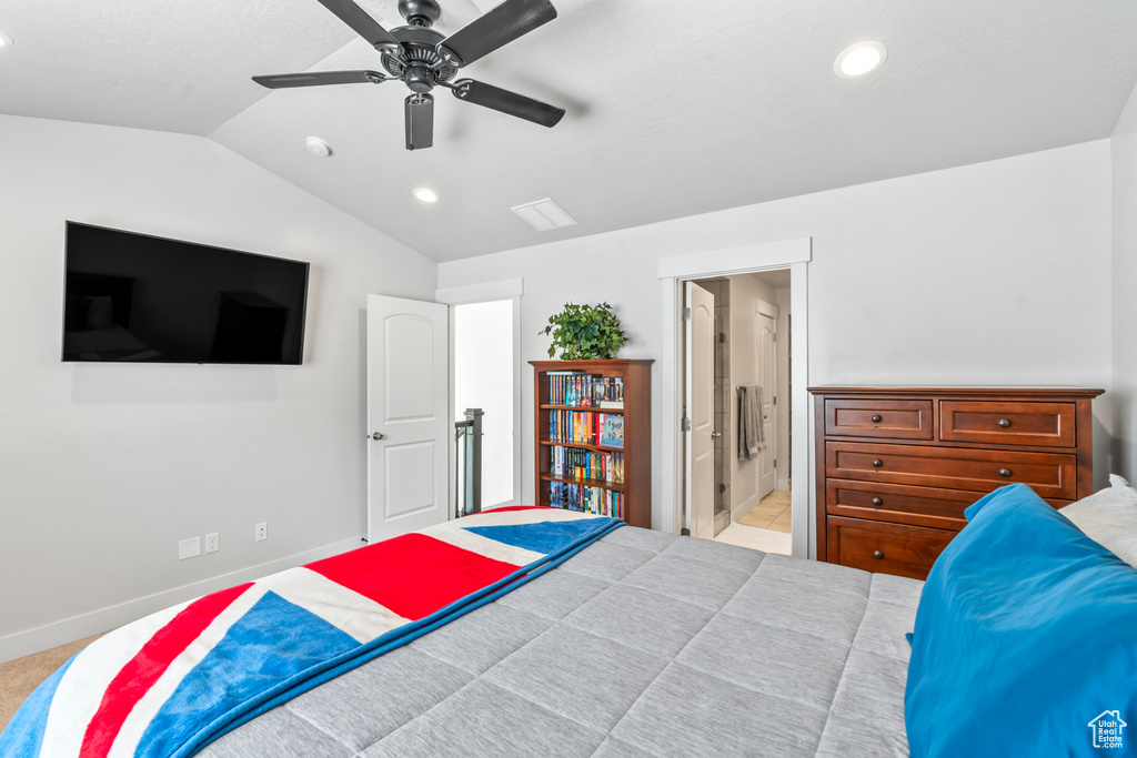 Bedroom featuring lofted ceiling, recessed lighting, baseboards, ensuite bath, and a ceiling fan