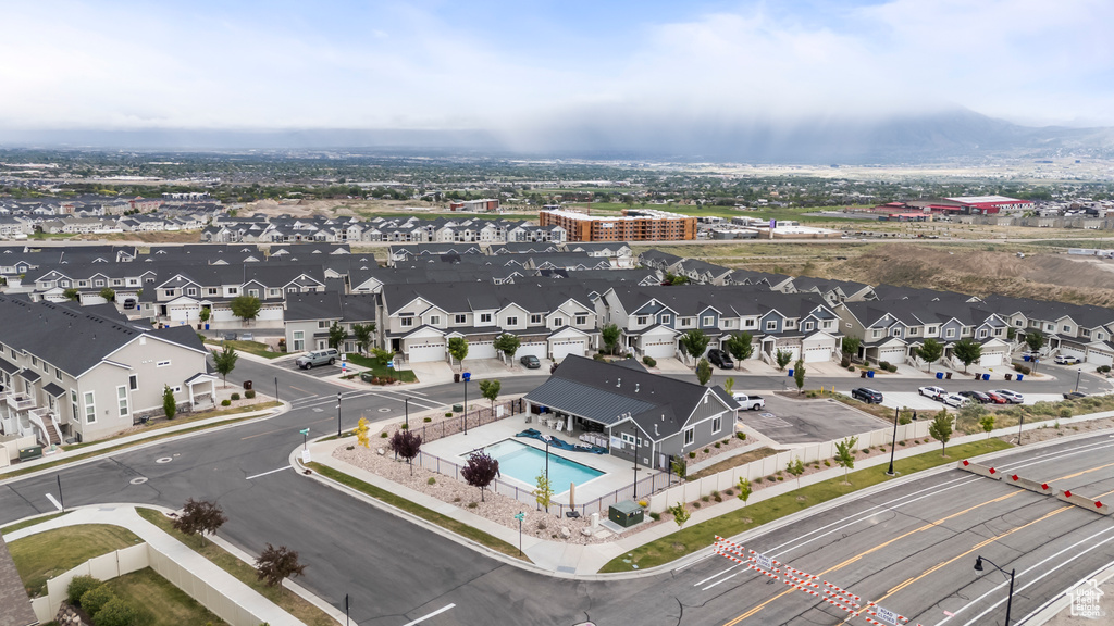 Aerial view of residential area featuring a pool area