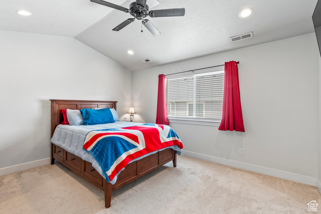 Carpeted bedroom with baseboards, recessed lighting, vaulted ceiling, and a ceiling fan