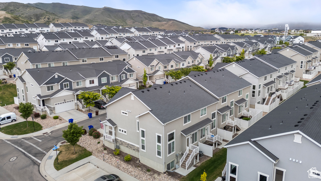 Aerial perspective of suburban area featuring a mountain backdrop