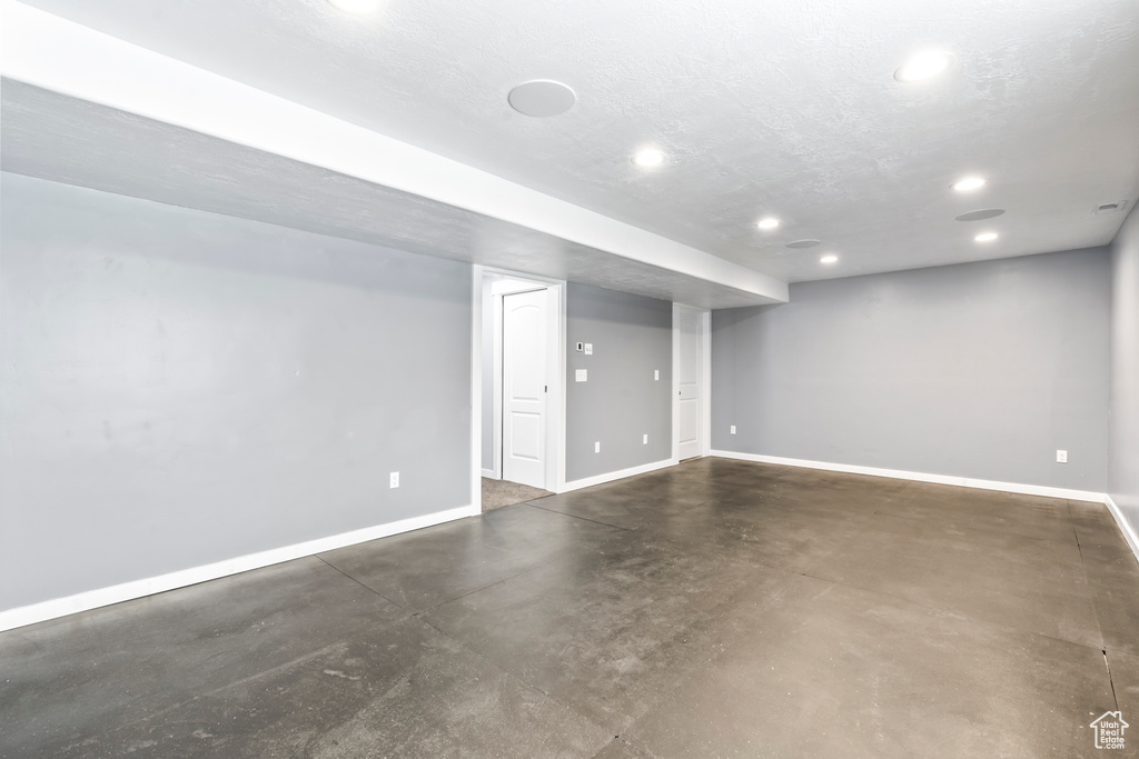Finished below grade area with recessed lighting and baseboards