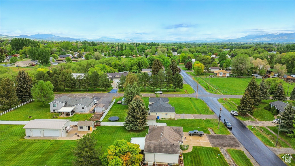 Aerial perspective of suburban area with a mountainous background