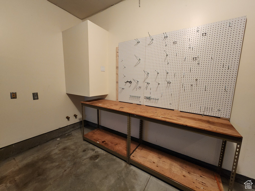 Mudroom with concrete floors and a workshop area