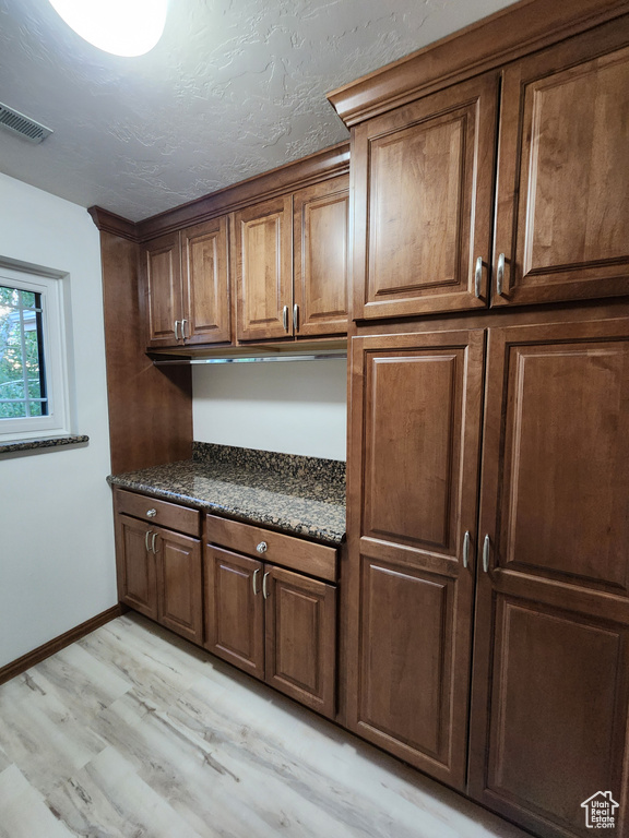 Kitchen featuring light wood finished floors and baseboards