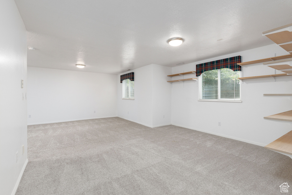 Below grade area featuring carpet flooring and baseboards