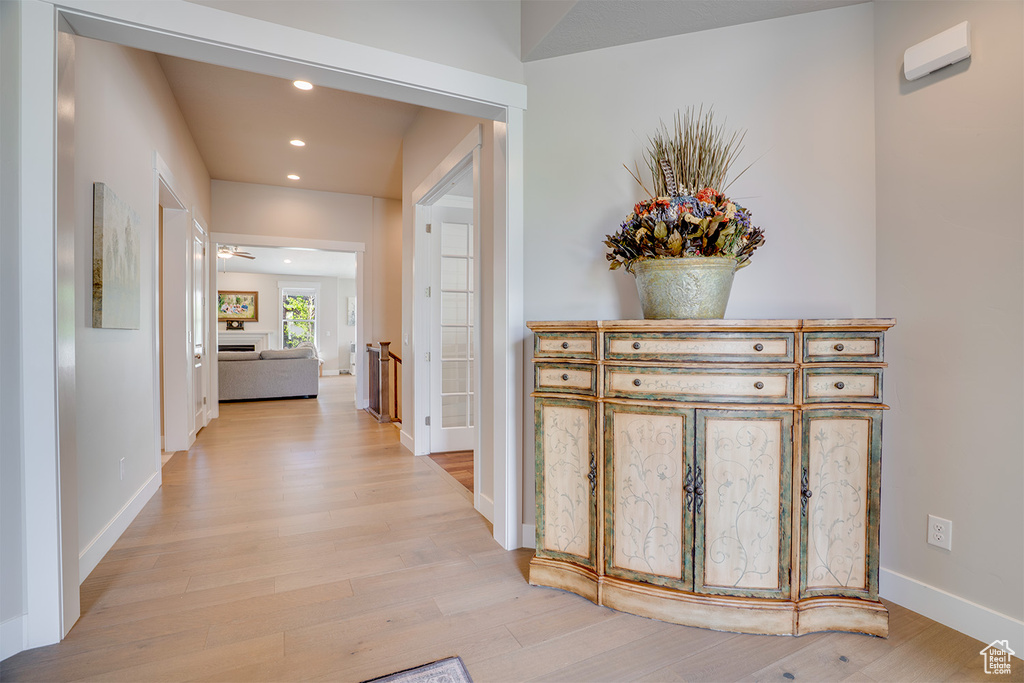 Hall featuring recessed lighting, light wood-style floors, and baseboards