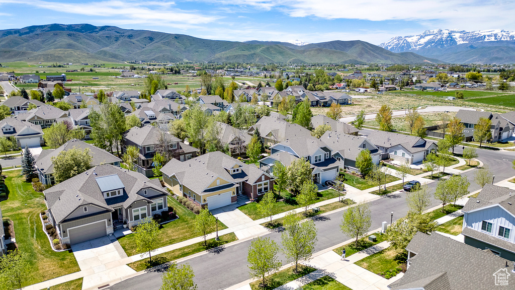 Aerial perspective of suburban area with a mountain backdrop