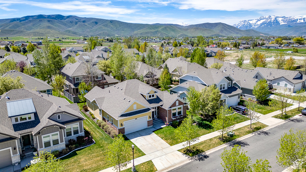 Aerial view of residential area featuring mountains