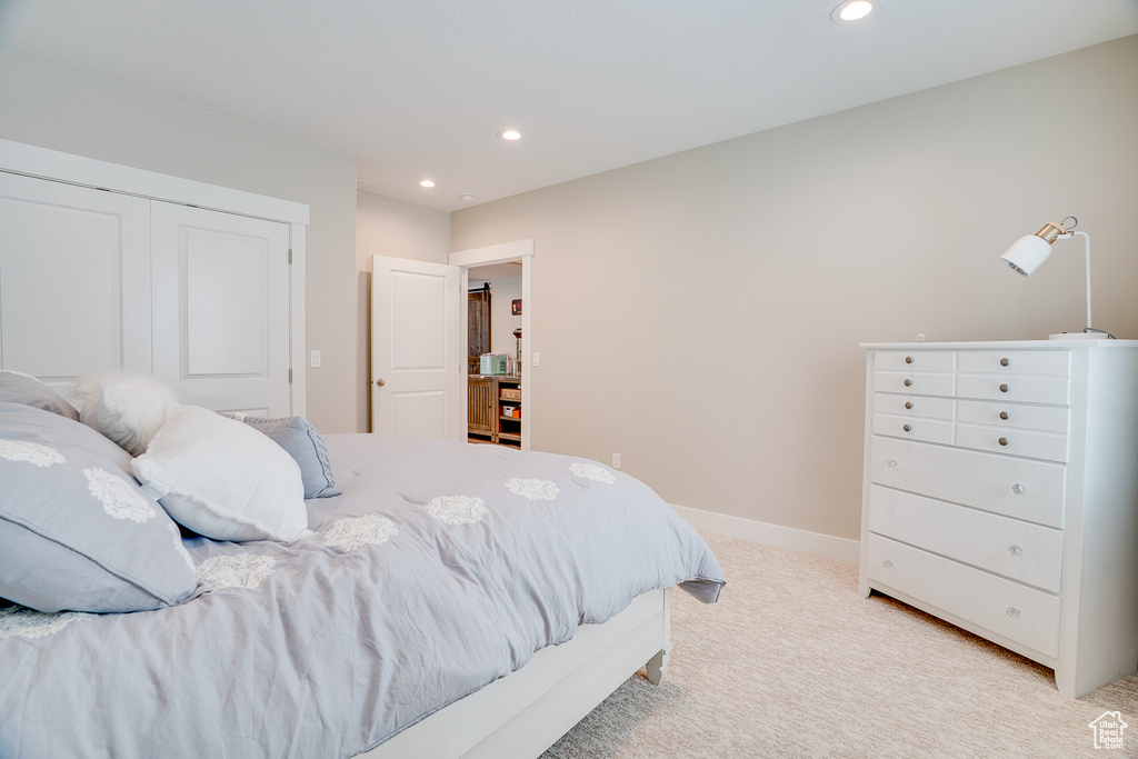 Bedroom with recessed lighting, light carpet, and baseboards