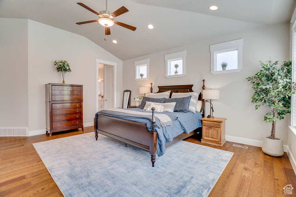 Bedroom with light wood-style flooring, lofted ceiling, baseboards, recessed lighting, and a ceiling fan