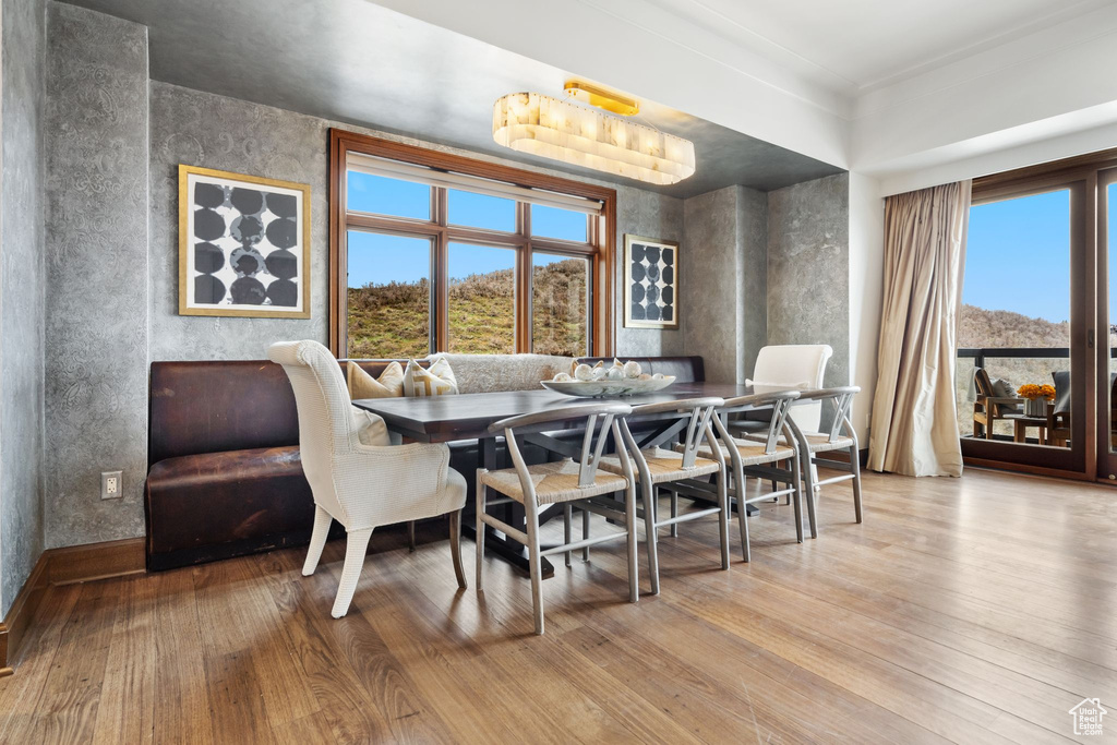 Dining room with wood finished floors and baseboards