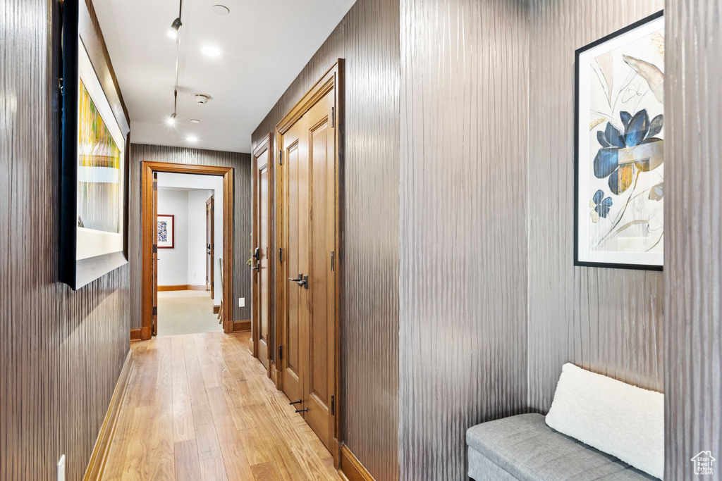 Hall featuring light wood-type flooring and recessed lighting