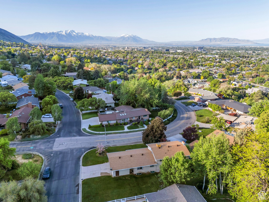 Aerial perspective of suburban area with a mountain backdrop