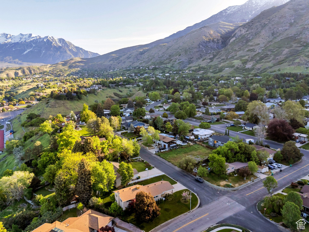 Aerial perspective of suburban area with a mountainous background