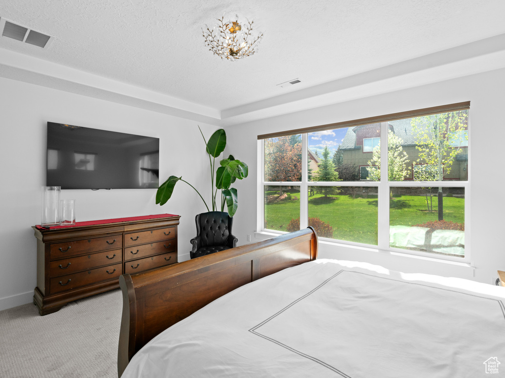 Carpeted bedroom with baseboards