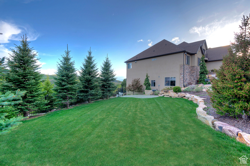 View of yard with a patio area