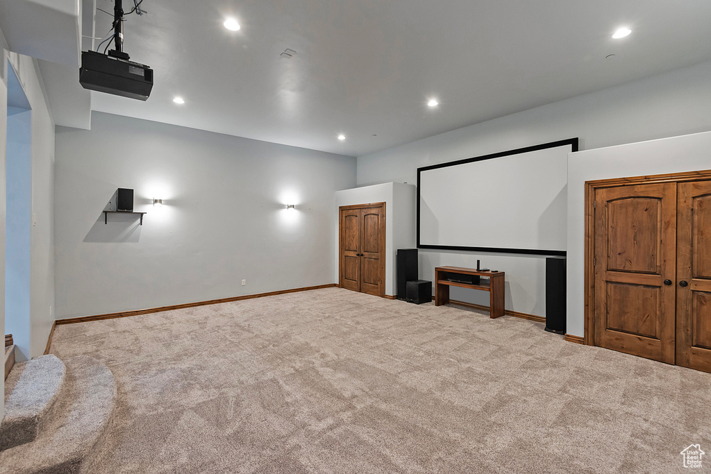 Cinema room featuring carpet floors, recessed lighting, and baseboards