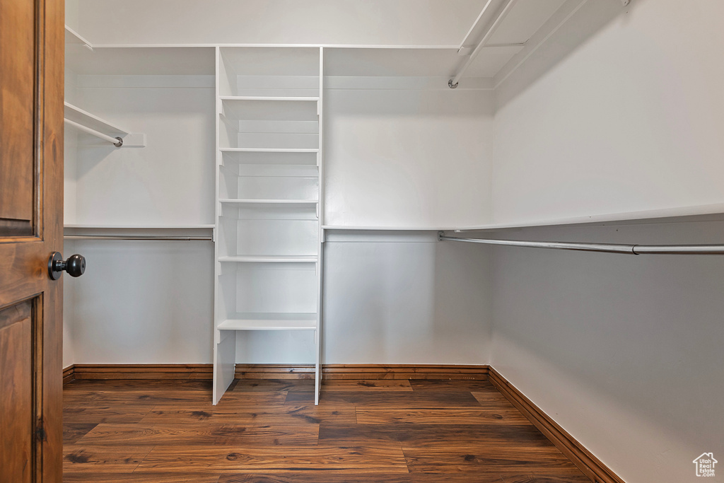 Spacious closet with wood finished floors