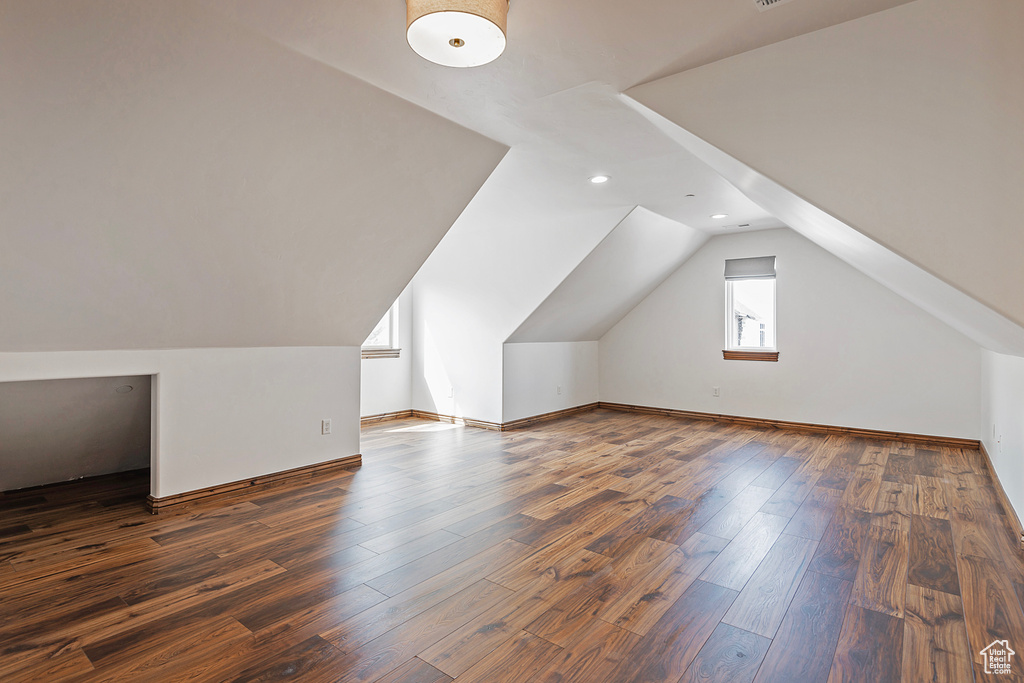 Bonus room featuring lofted ceiling, wood finished floors, recessed lighting, and baseboards