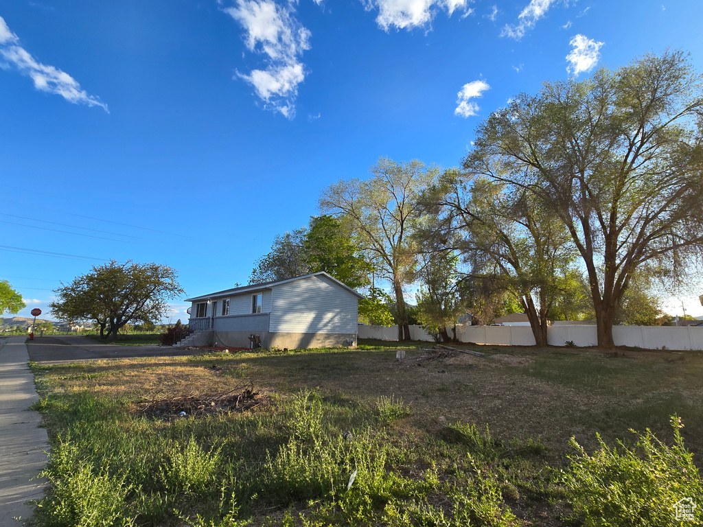 View of yard featuring fence