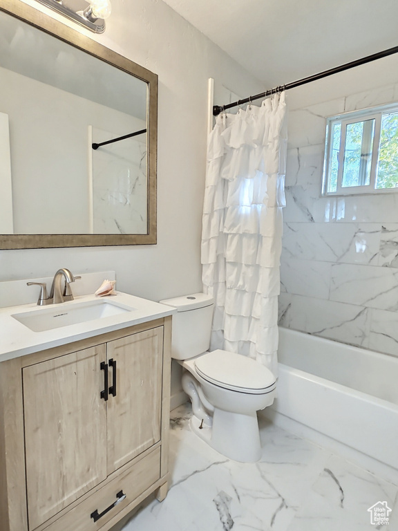 Bathroom with vanity, toilet, shower / bathtub combination with curtain, and marble finish floors