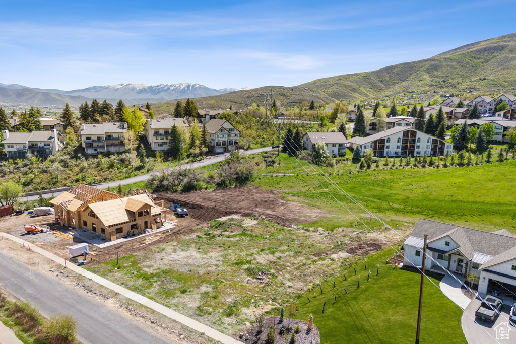 Aerial view of residential area featuring mountains