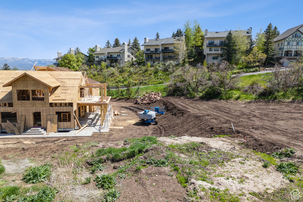 Rear view of property featuring a patio area and a residential view