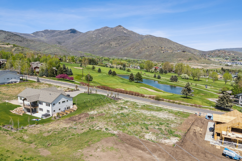 Aerial view of a water and mountain view and a golf club