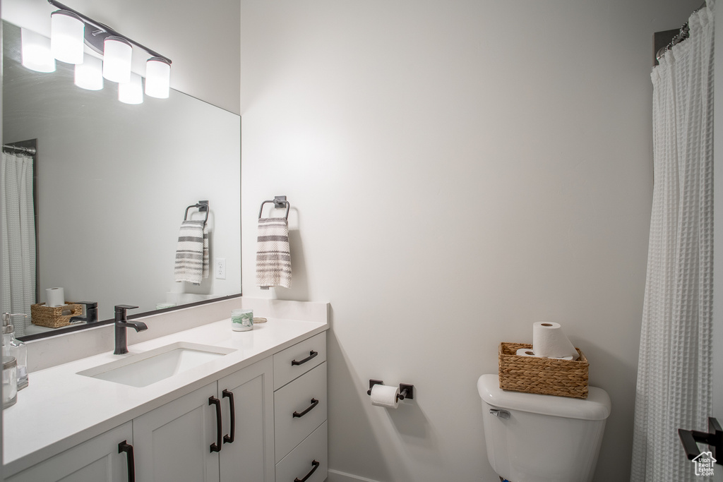 Bathroom with vanity and toilet