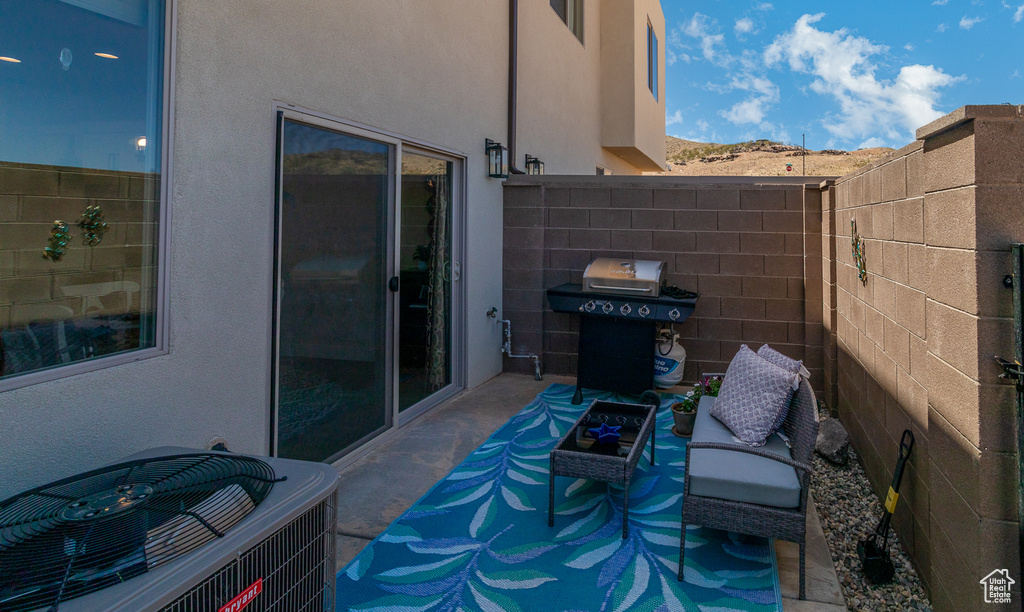 View of patio / terrace with central AC unit and grilling area