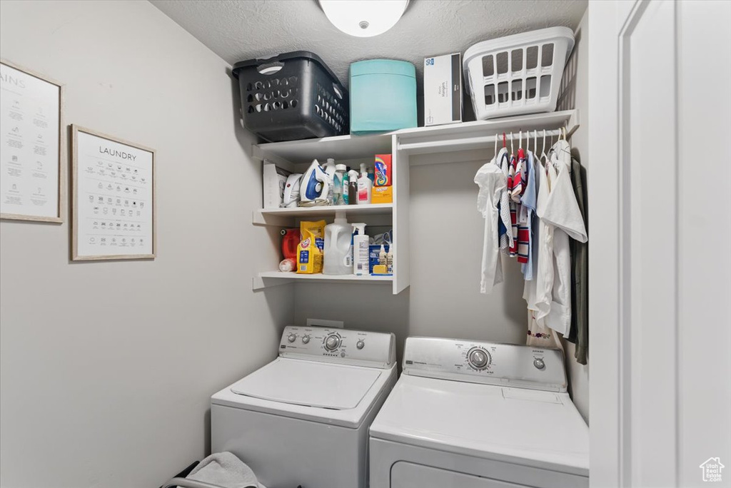 Laundry area featuring independent washer and dryer