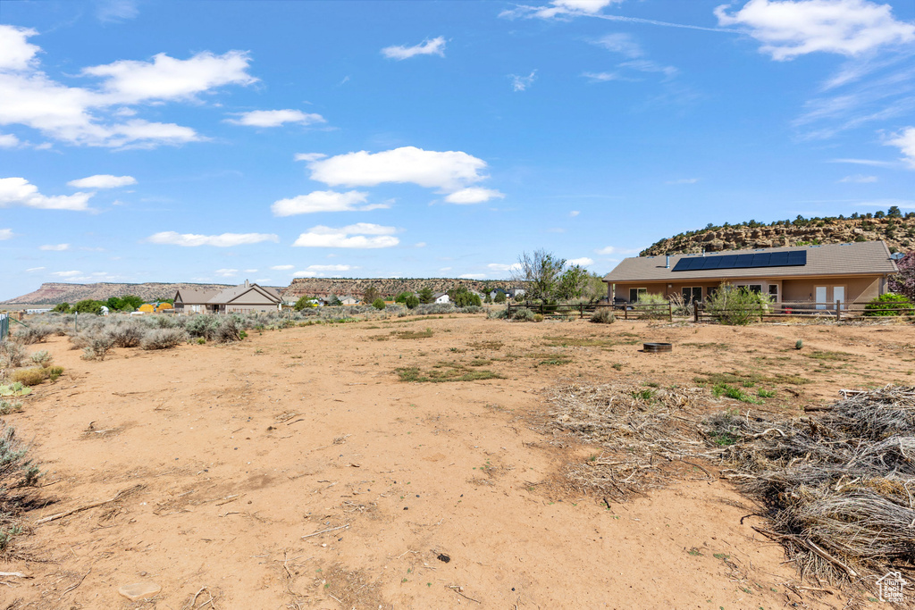 View of yard featuring fence
