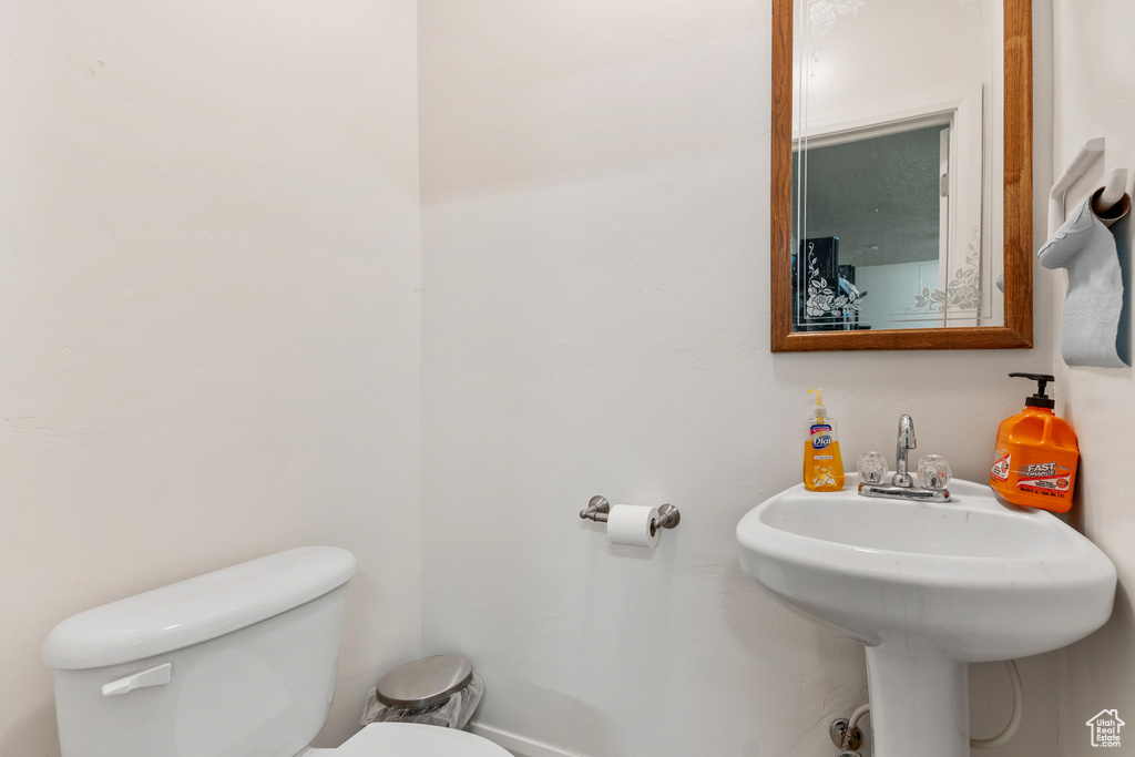 Bathroom with toilet and a sink