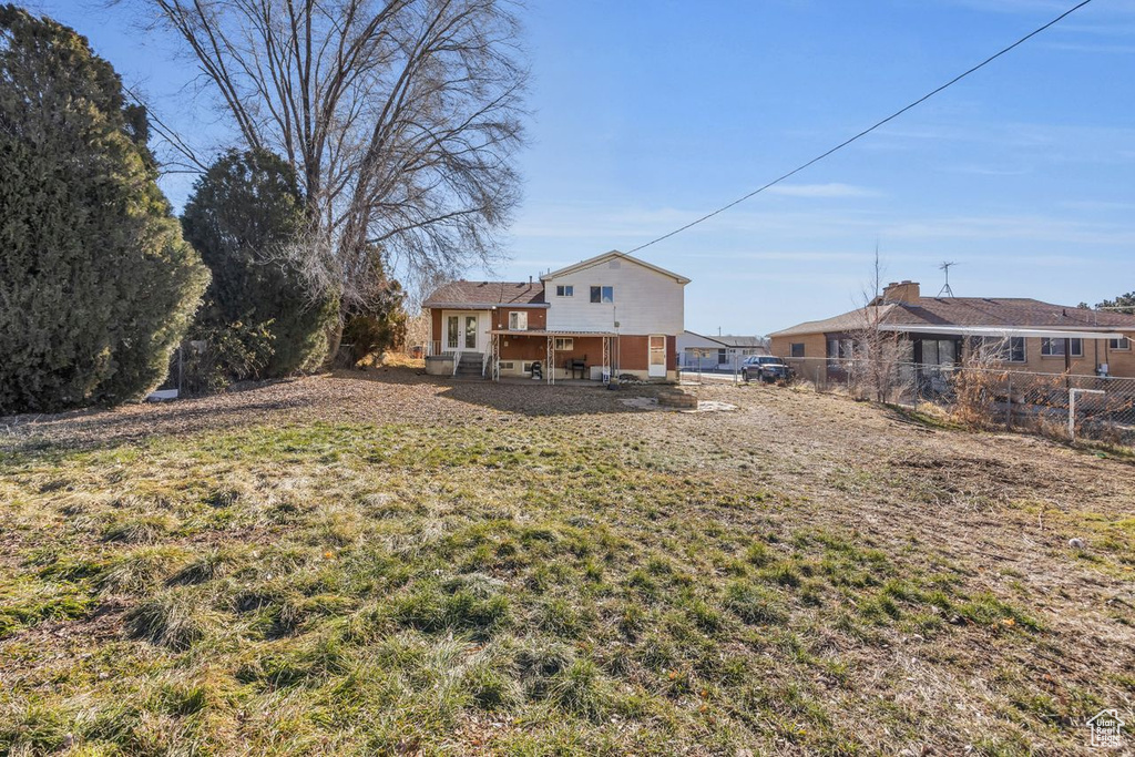 View of yard featuring fence
