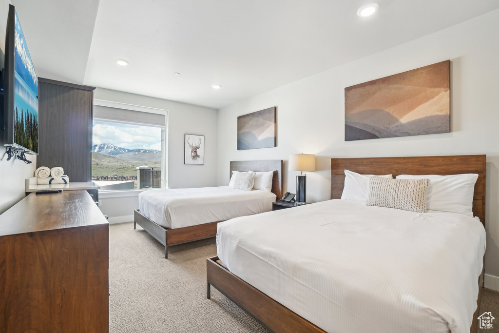Bedroom featuring light carpet and recessed lighting