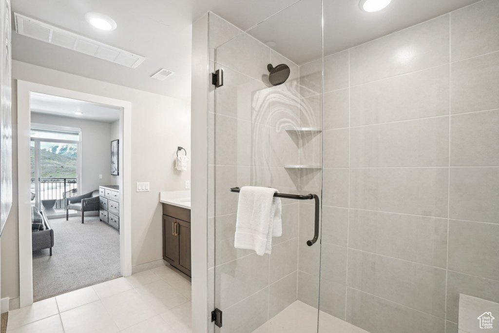 Full bathroom featuring a stall shower, vanity, recessed lighting, and tile patterned floors