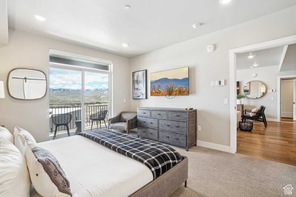 Bedroom with access to exterior, baseboards, recessed lighting, and carpet floors