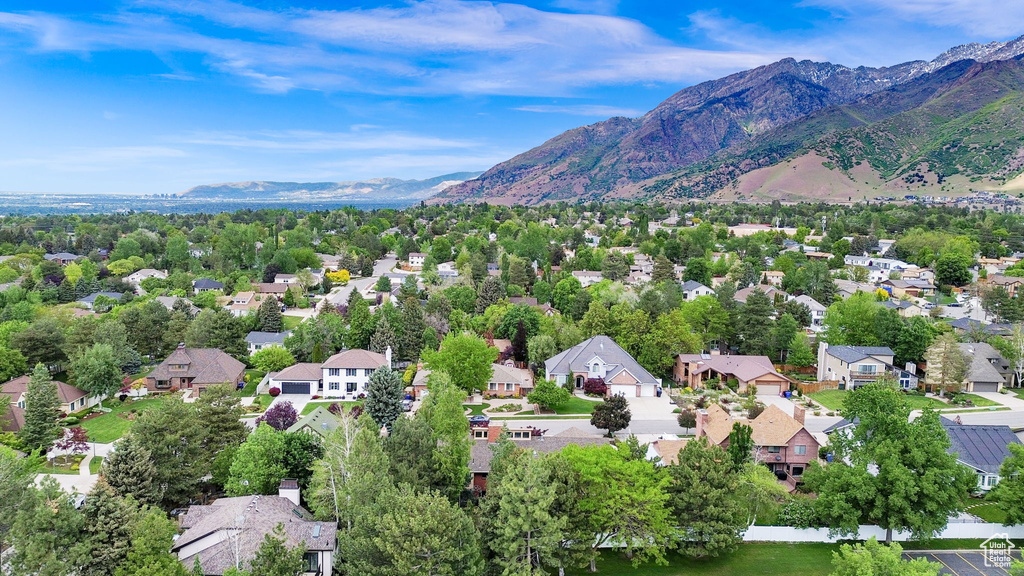 Aerial view of residential area featuring mountains