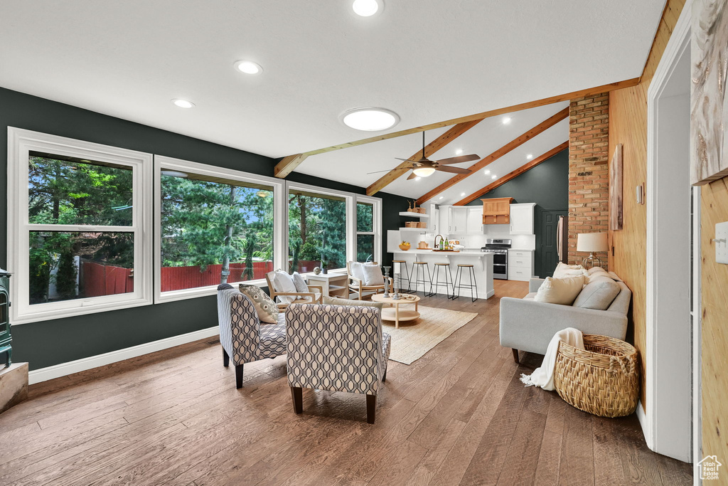 Living room with light wood-type flooring, recessed lighting, and ceiling fan
