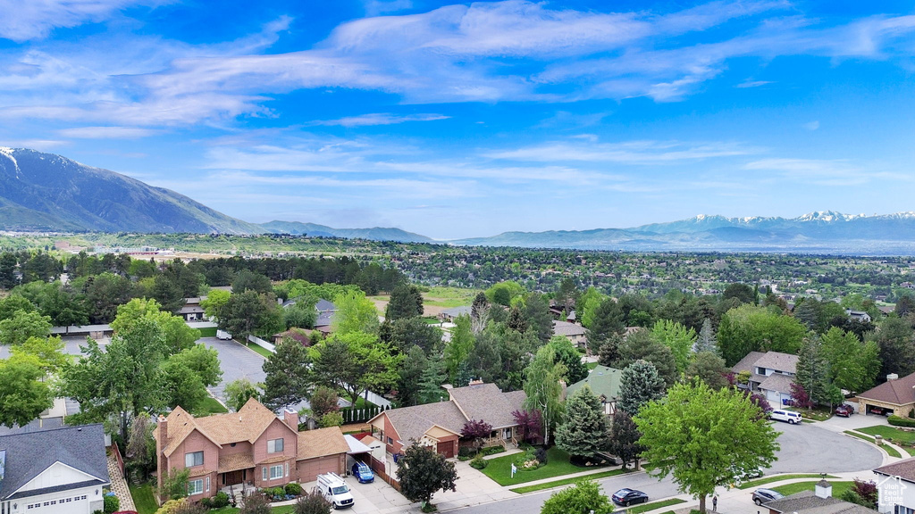 Aerial perspective of suburban area with a mountainous background