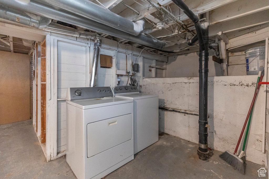 Laundry area with washing machine and clothes dryer
