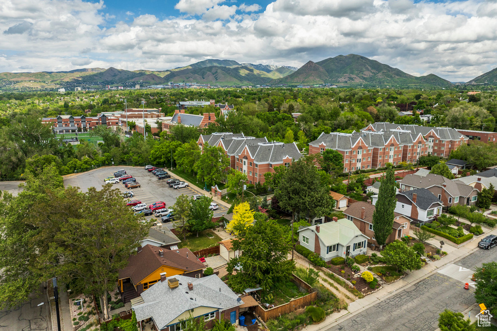 Aerial perspective of suburban area featuring a mountain backdrop