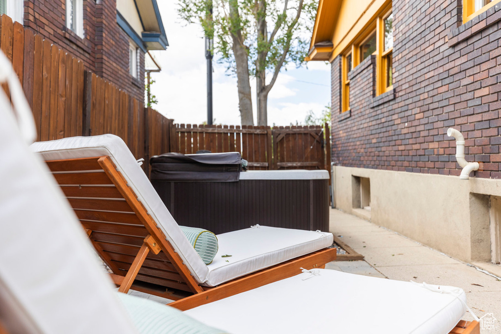 View of patio featuring fence
