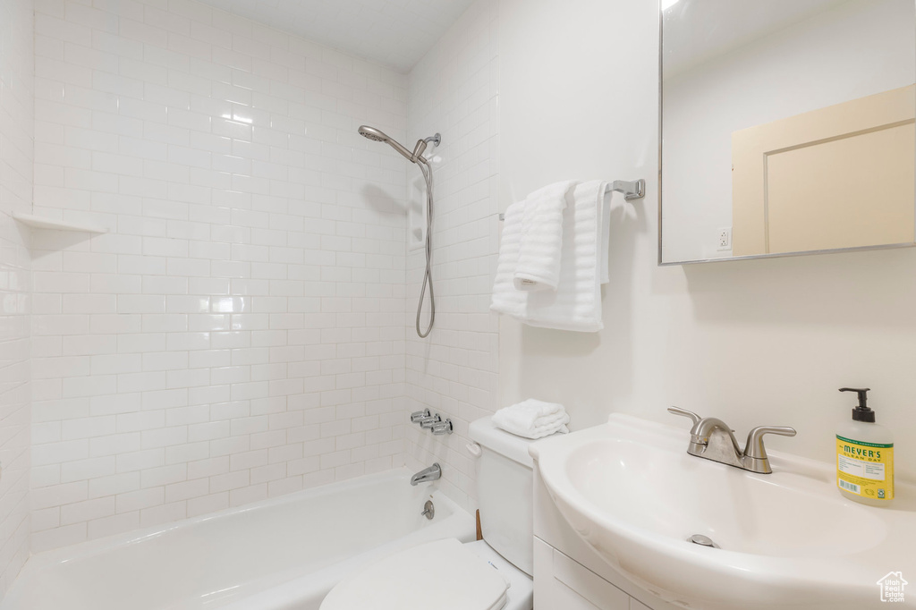 Full bathroom featuring toilet, shower / washtub combination, and vanity